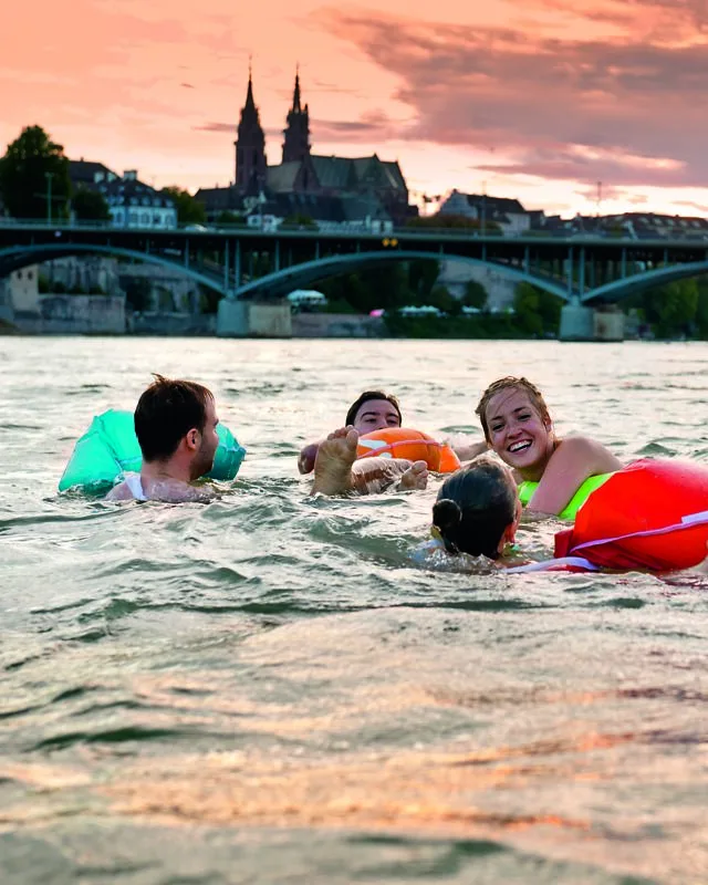 Friends swimming in the Rhein in the summer 800px