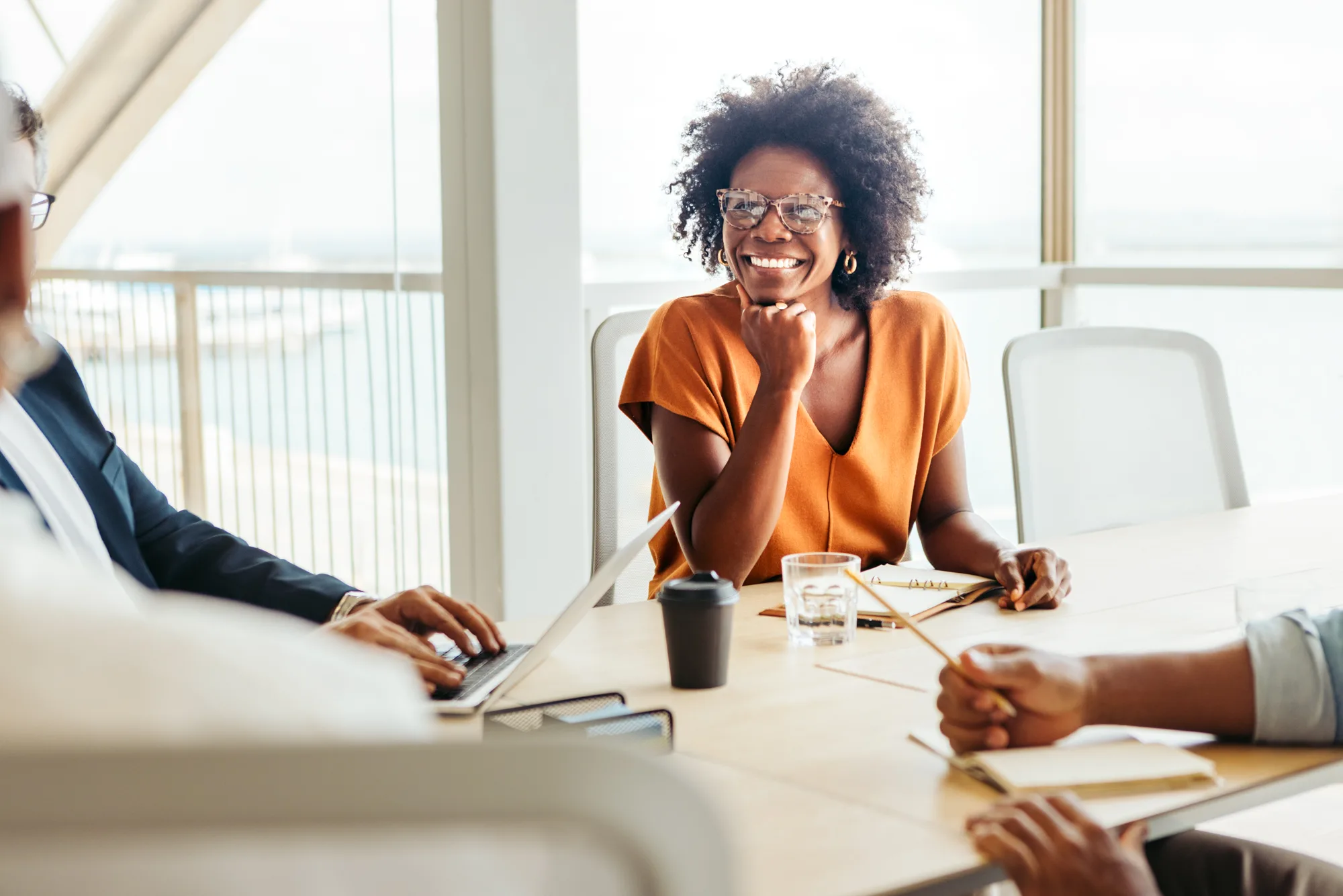 Woman smiling in a business meeting