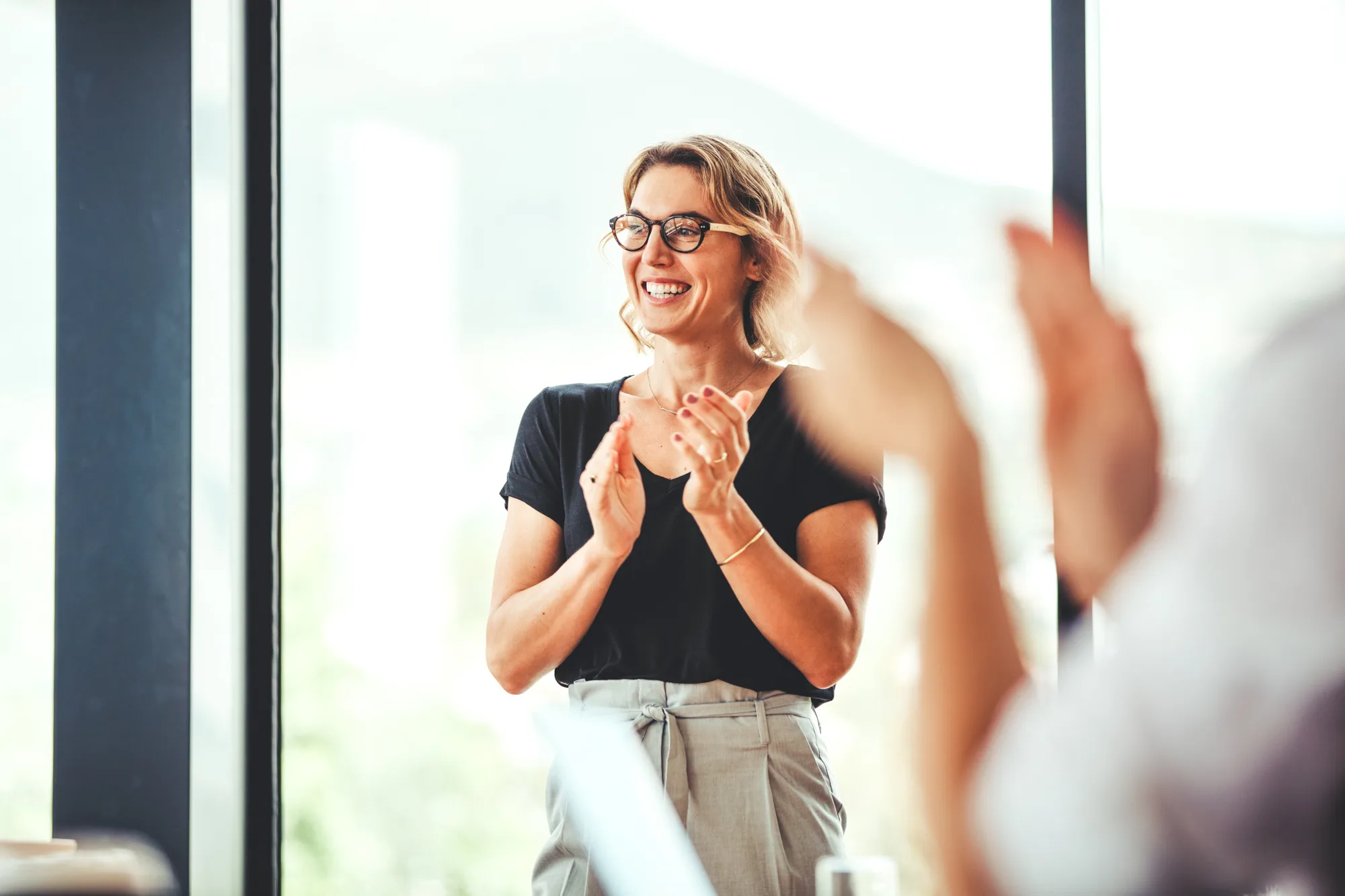 Person clapping after a presentation