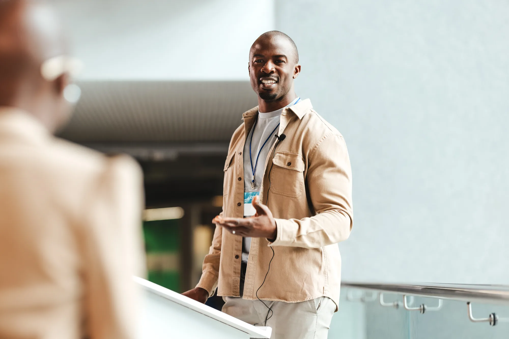 man smiling and having a conversation