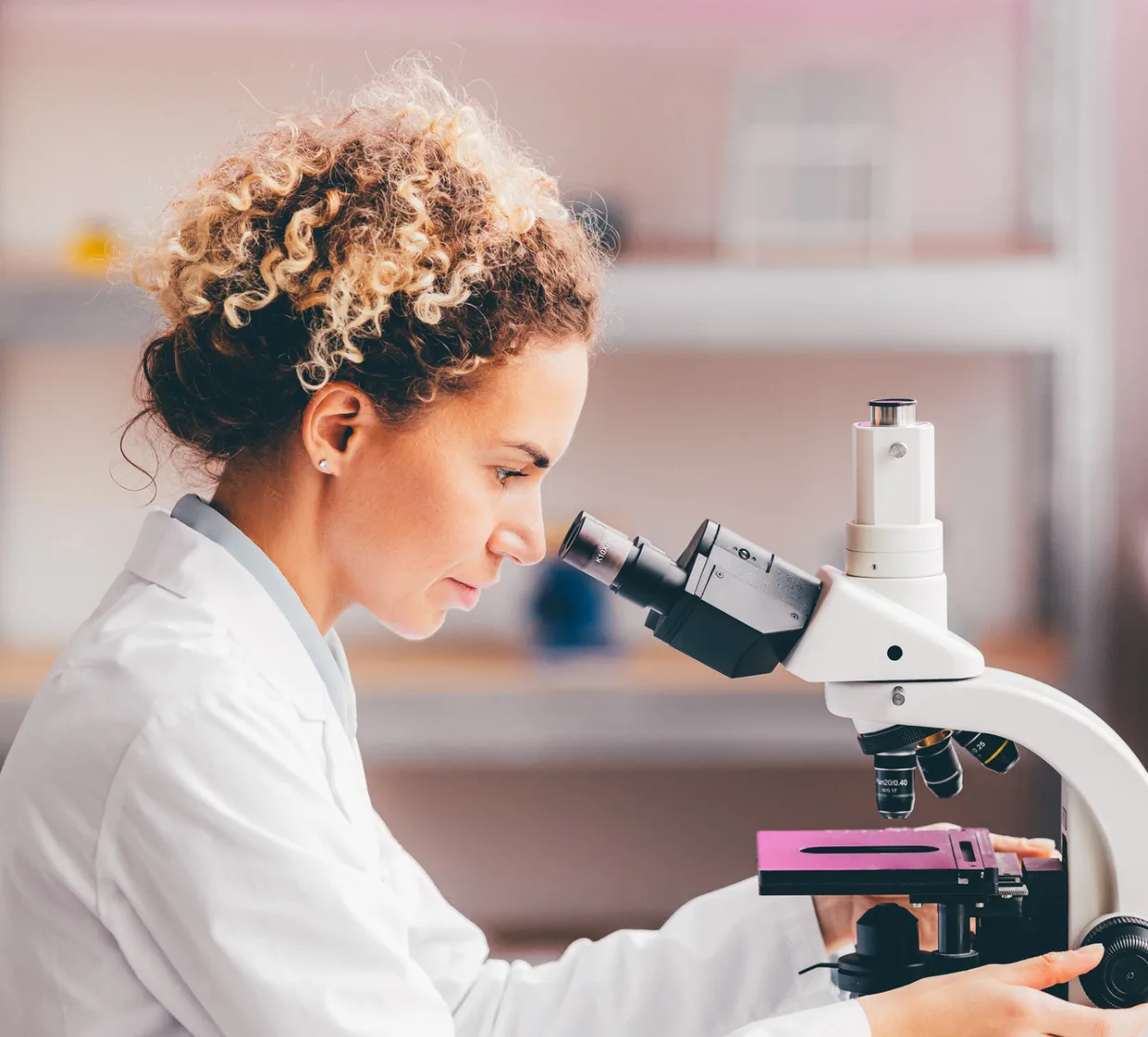 Scientist looking at a microscope