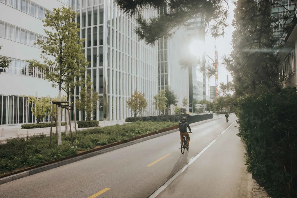 Person cycling through the Roche towers in Basel